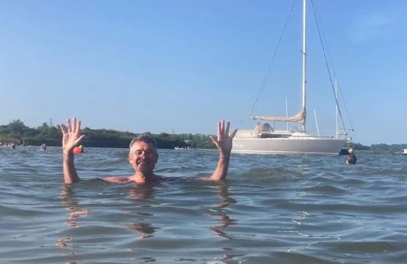 Bernard swimming in river Stour at Manningtree Beach