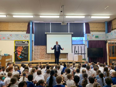 Sir Bernard giving assembly at Broomsgrove school