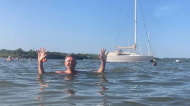 Bernard swimming in river Stour at Manningtree Beach